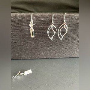 GIVENCHY silver costume earrings.   Two for the price of one.
